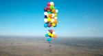 VIDEO: British man flies across South Africa on a chair tied to 100 helium balloons!