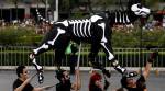 In burgeoning Day of the Dead parade, Mexico remembers earthquake casualties