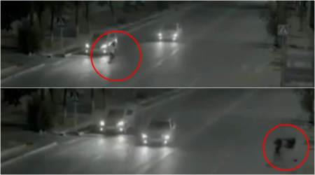 VIDEO: Ghost or super human? Guy 'flashes' across to save girl from getting run over by car