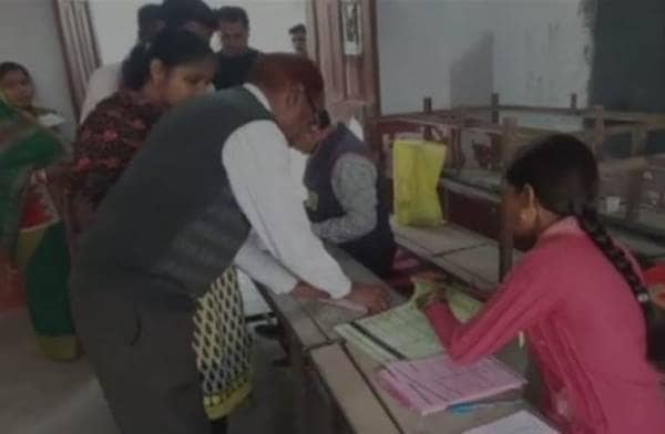 Uttar Pradesh Chief Minister Yogi Adityanath arrives at a polling station in Gorakhpur to cast his vote.