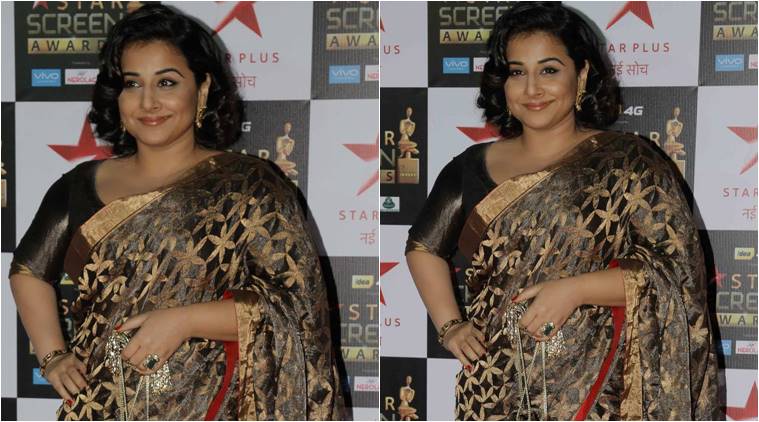 Vidya Balan drapes a golden Raw Mango sari at the Star Screen Awards.