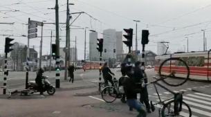 VIDEO: Biker struggles to hold ground after powerful wind blows him away