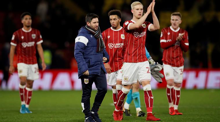 Bristol City manager Lee Johnson and Hordur Magnusson after the match against Watford