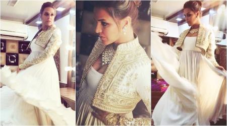 Neha Dhupia gives us another reason to crush on white in this Rohit Bal jacket