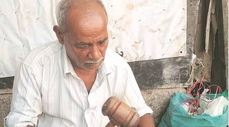 On the job: Man, grandson repair cricket bats for a living