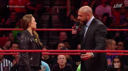 Ronda Rousey slams Triple H through table at WWE Elimination Chamber 2018; watch video