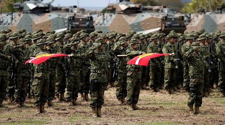 Soldiers of Japanese Ground Self-Defense Force (JGSDF)'s Amphibious Rapid Deployment Brigade, Japan's first marine unit since World War Two, attend a ceremony activating the brigade at JGSDF's Camp Ainoura in Sasebo, on the southwest island of Kyushu, Japan on Saturday. (Reuters)
