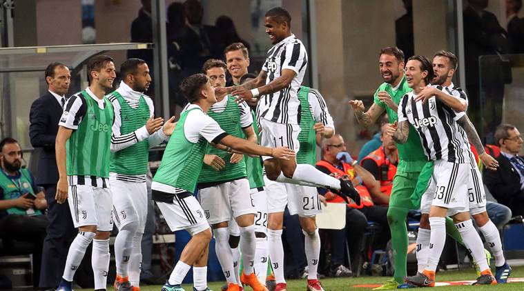 Juventus players celebrate Douglas Costa's goal against Inter Milan