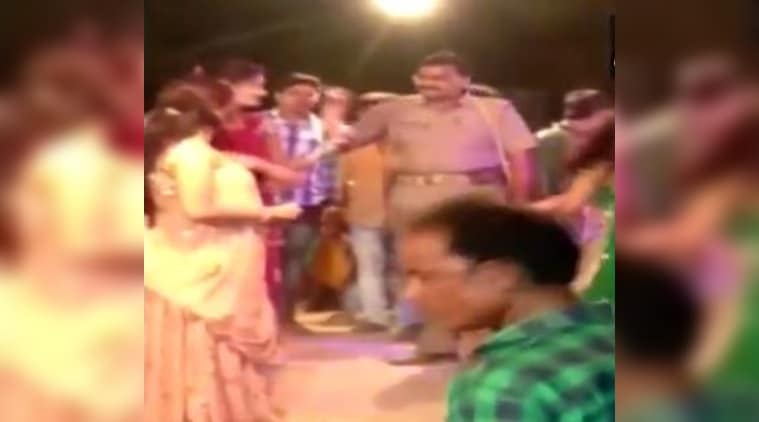 A police constable and an officer were suspended after a video of the two dancing to Bollywood songs and throwing notes on dancers went viral on social media. (Photo: Twitter/ANI)