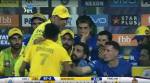 Dhoni's fan runs to touch his idol's feet