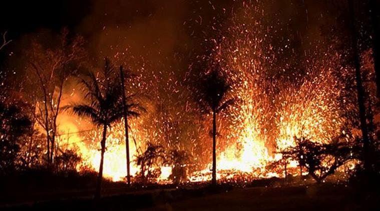 A new fissure spraying lava fountains as high as about 230 feet (70 m), according to United States Geological Survey, is shown from Luana Street in Leilani Estates subdivision on Kilauea Volcano's lower East Rift Zone in Hawaii. (Reuters)