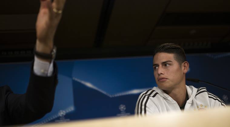 Bayern Munich's James Rodriguez talks to journalists during a news conference at the Santiago Bernabeu stadium in Madrid