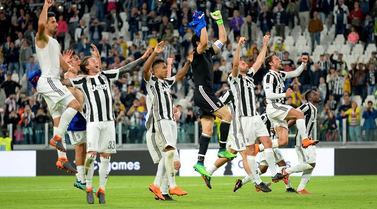 Juventus players celebrate after the match against Bologna
