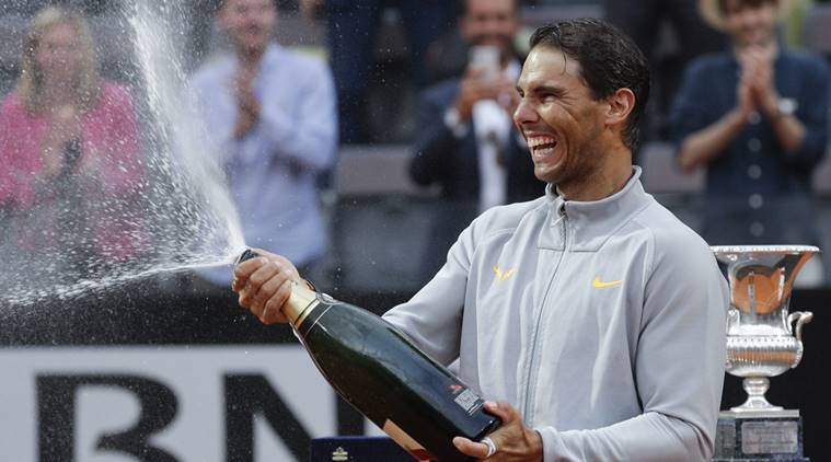 Spain's Rafael Nadal sprays sparkling wine as he celebrates after beating Germany's Alexander Zverev in the final match of the Italian Open