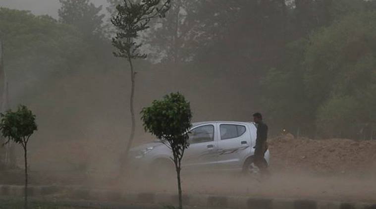 Dust storm accompanied by rain also hit Chandigarh and its surrounding areas in Punjab, Haryana and Himachal Pradesh, bringing down the temperature. (Express Photo by Sahil Walia)
