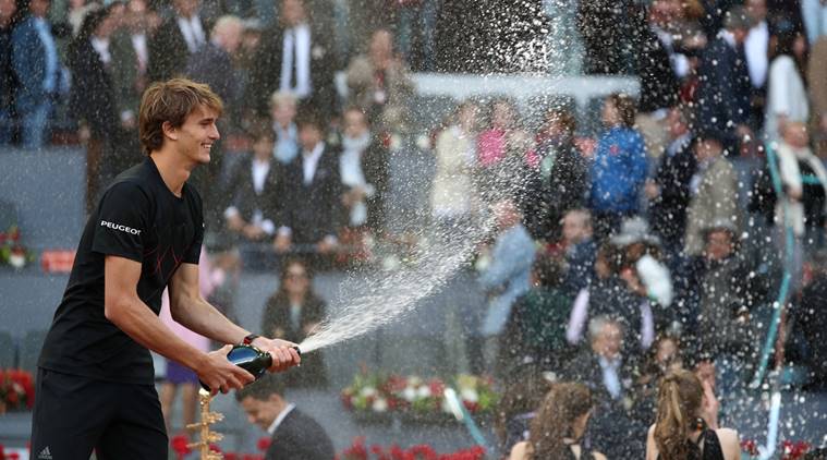 Germany's Alexander Zverev sprays champagne as he celebrates after winning the final against Austria's Dominic Thiem