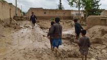 Flash floods due to unusually heavy seasonal rains kill at least 68 people in Afghanistan