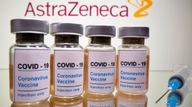 FILE PHOTO: Vials and medical syringe are seen in front of AstraZeneca logo in this illustration India coronavirus vaccine news, vaccine news india, india latest vaccine news, Covishield, coronavirus vaccine, coronavirus oxford vaccine, oxford-astrazeneca vaccine, covishield vaccine india, serum institute of india, india coronavirus vaccine, vaccine news india