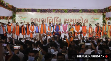 Gujarat's new Cabinet Ministers take oath at the Raj Bhawan in Gandhinagar on Thursday. (Express Photo: Nirmal Harindran)