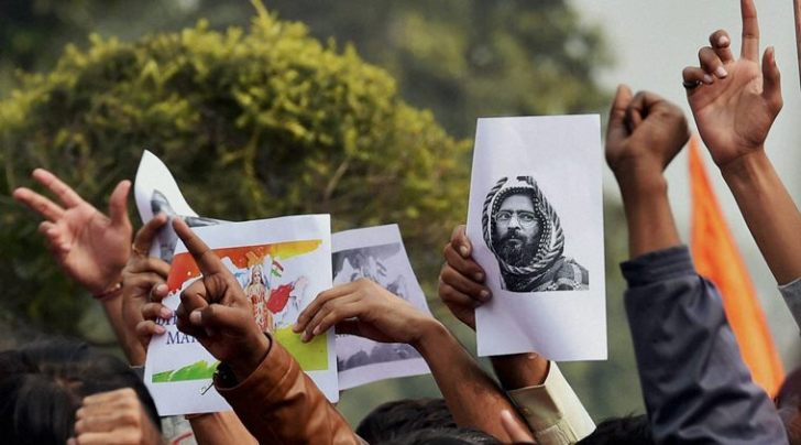 ABVP activists protest against an event at JNU supporting Parliament attack convict Afzal Guru in New Delhi on Friday. (PTI Photo by Kamal Singh)
