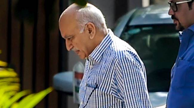 New Delhi: Union minister M J Akbar (L), who is facing allegations of sexual harassment by a number of women journalists, at his residence after his arrival from a foreign tour, in New Delhi, Sunday, Oct 14, 2018. (PTI Photo/Vijay Verma)(PTI10_14_2018_000058A)
