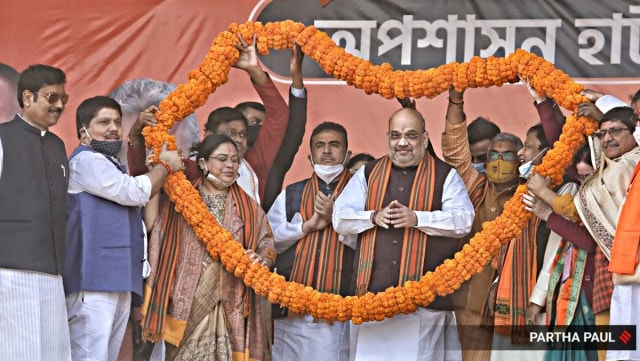 Union Home Minister Amit Shah is seen along with West Bengal political heavyweight Suvendu Adhikari at a rally in Midnapore. (Express Photo by Partha Paul)
