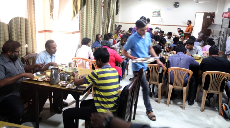 Customers at the Kerala House canteen. (Source: Express Photo by Tashi Tobgyal) 
