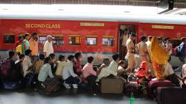 Amid yoga, TV and chai, group at Varanasi station asks: Will trains take us home?