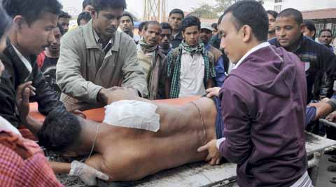 An injured police person brought to the Guwahati Medical College Hospital (GMCH) for treatment. (PTI photo)