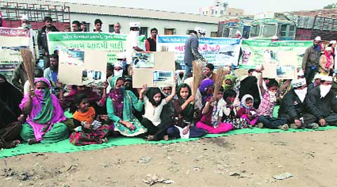 Aam Aadmi Party workers outside a primary school in Danilimda area of the city on Saturday. Javed Raja