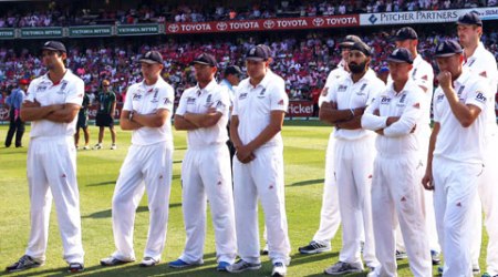 England's captain Alastair Cook (L) reacts next to his teammates during the presentation after they lost the fifth Ashes Test against Australia (Reuters)