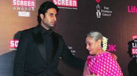 Jaya Bachchan being escorted by son Abhishek Bachchan