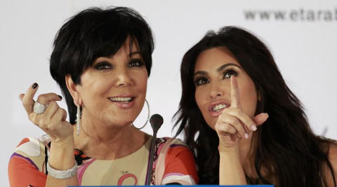 Kris Jenner reveals that Kim is a very hands-on mother and hates handing her little girl over to anyone - even her. (Reuters)