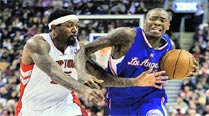 Los Angeles Clippers' Jamal Crawford, (R) drives past Toronto Raptors' John Salmons. Crawford finished with 37 points.