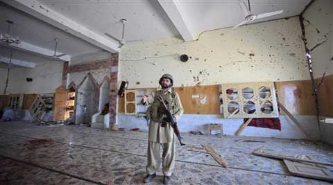 A paramilitary soldier secures the site of a sucide bomb attack. Reuters