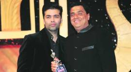 Karan Johar hands over the Screen Outstanding Performer Award to 
Ronnie Screwvala