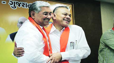 BJP State unit president R C Faldu (left) with GPP president Gordhan Zadaphia in Ahmedabad on Monday. express