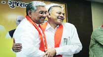 BJP State unit president R C Faldu (left) with GPP president Gordhan Zadaphia in Ahmedabad on Monday. 	express