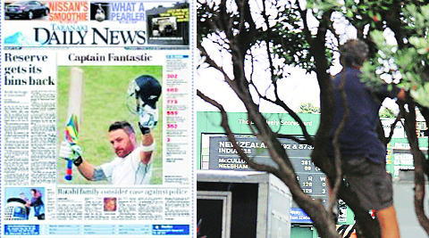 Brendon McCullum, NZ’s first triple-centurion, made it to the front page of Daily News, a rare high for cricket in a rugby-crazy nation. A spectator risks a limb to watch McCullum complete his 300 at the Basin Reserve on Tuesday.  (Daksh Panwar)