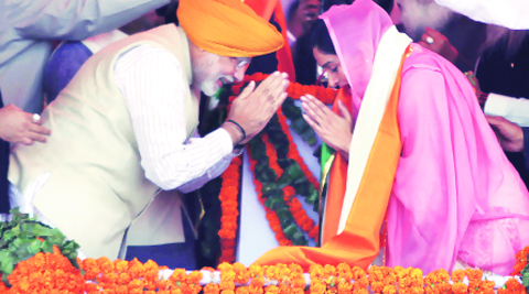 Narendra Modi greets Akali Dal MP Harsimrat Kaur on Sunday. He said Punjab CM Parkash Singh Badal is his ‘political guru’.Gurmeet Singh