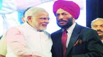 Narendra Modi with Milkha Singh in Surat Sunday. 	PTI 