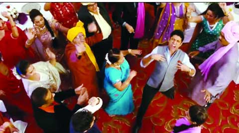 An elderly lady dancer gives Farhan Akhtar his cue to dance wildly on the floor