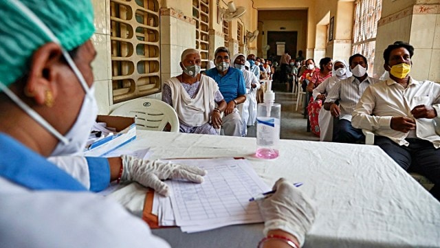 People wait for their turn to be administered COVISHIELD vaccine at a government hospital in Hyderabad, India, Monday, April 12, 2021. (AP Photo)