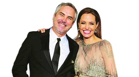 Alfonso Cuaron and Angelina Jolie at the Oscars