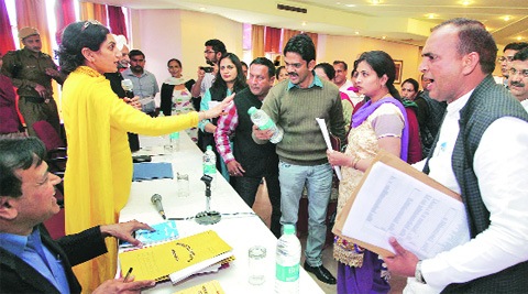 Panchkula Mayor Upinder Kaur and other corporation officers try to pacify protesting councillors at the House meet in Panchkula on Monday