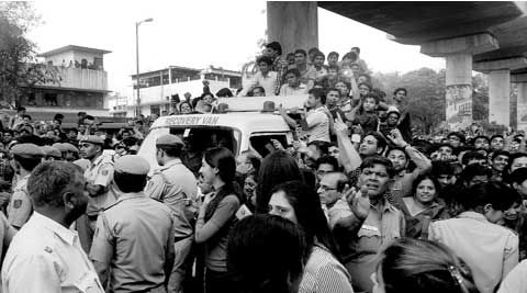 People crowd on a traffic recovery van to see actress Aishwarya Rai at the launch of  a jewellery showroom in  Karol Bagh. (Praveen Khanna)