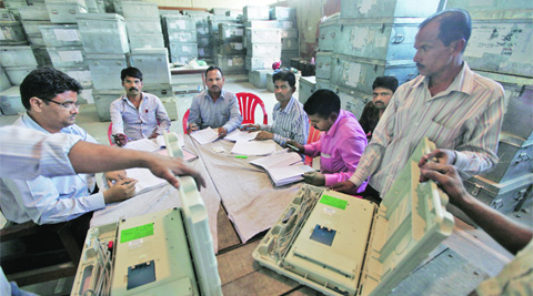 The Election Department employees check Electonic Voting Machines for the Lok Sabha elections in Lucknow, Tuesday. (Vishal Srivasta)
