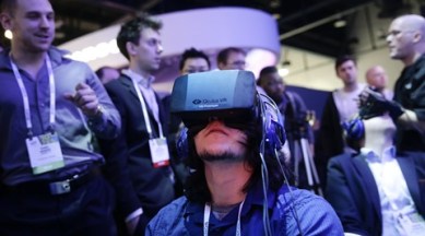 A file photo of a delegate playing a video game wearing Oculus Rift virtual reality headsets at the Intel booth at the International Consumer Electronics Show (CES), in Las Vegas this year. (AP)