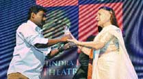 M.G. Jyothish receives his award from Sushma Seth