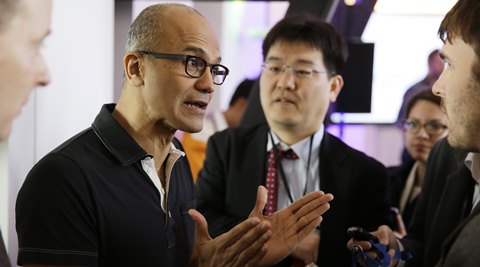 Microsoft CEO Satya Nadella gestures while speaking with reporters after giving a press briefing on the intersection of cloud and mobile computing. (AP)